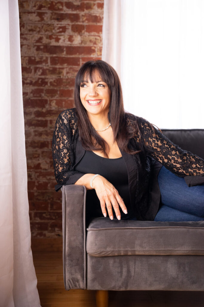 Studio Portrait Woman Smiling Gray Chair The Bevard Studio
