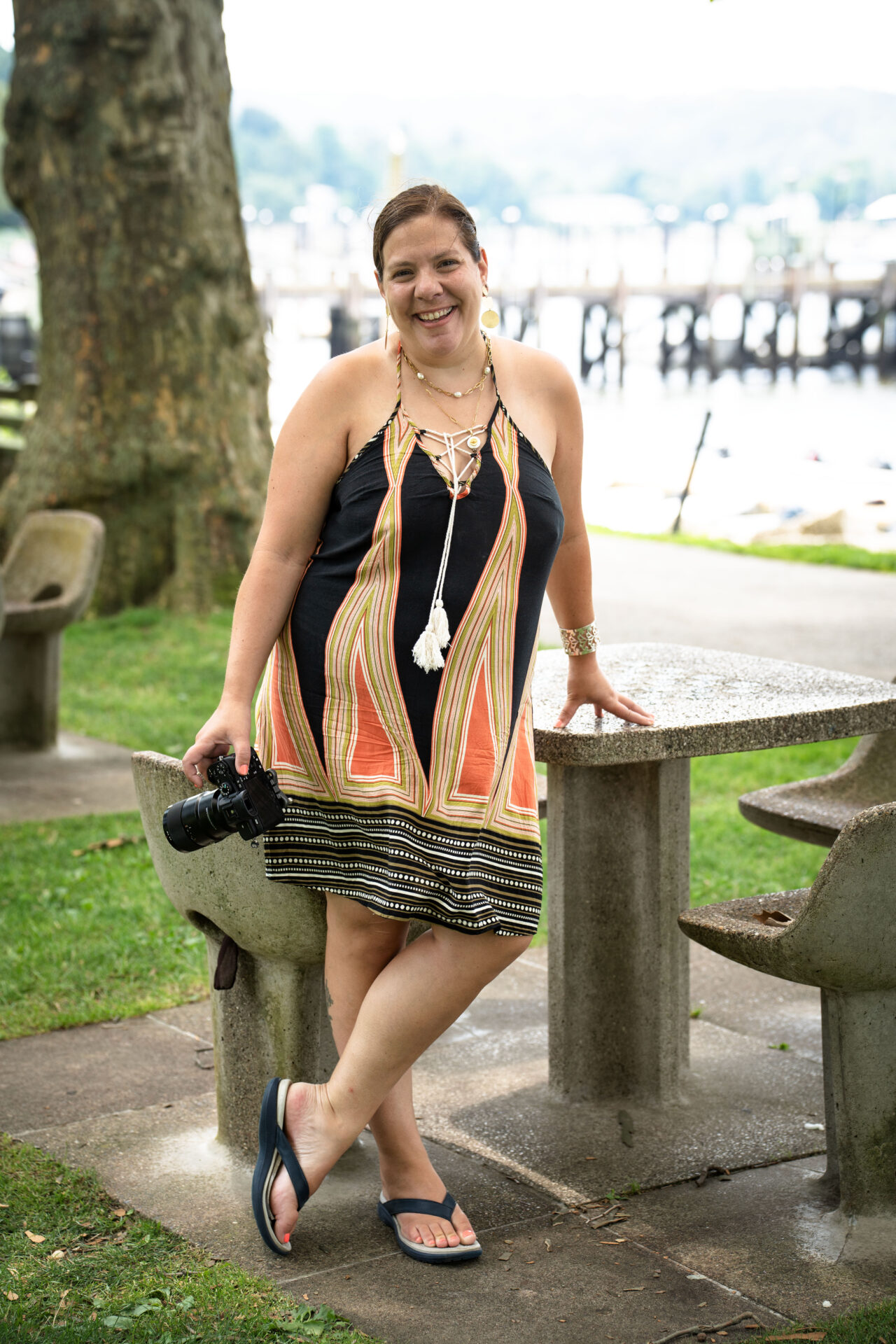 Woman in colorful dress by water in Huntington long island